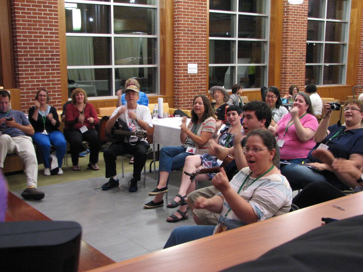 Educators gathered on the lawn for a job board meetup