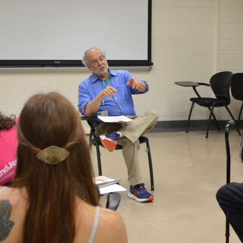 Presenter leading a small group session in a classroom