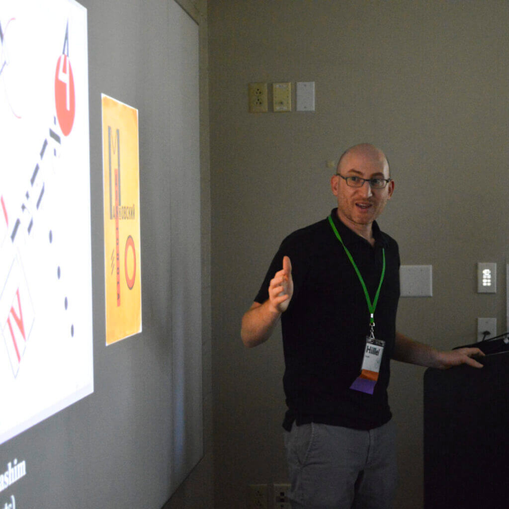 Presenter in a lanyard leading a workshop
