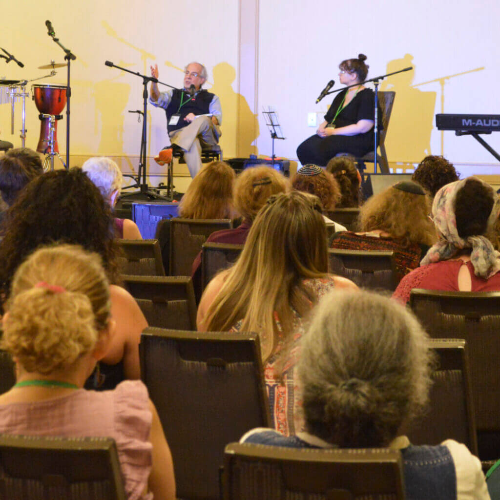 Audience watching musicians perform on stage