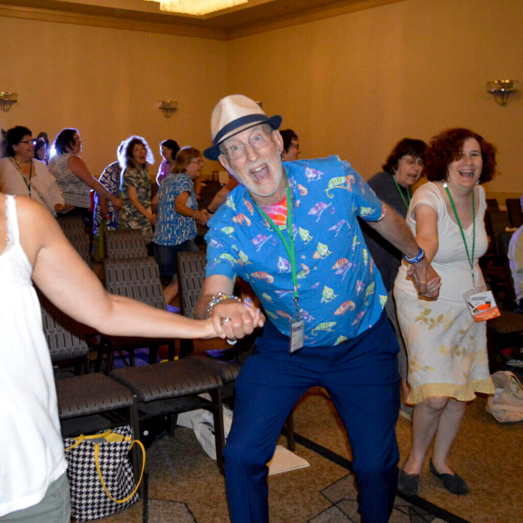 Educators dancing in a room